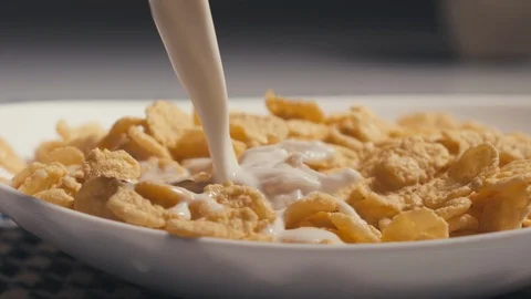 Pouring Milk on Corn Flakes. Slow Motion Video stock 98853902