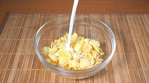 Pouring milk into Cornflakes, Slow Motion Stock-Footage 59893177