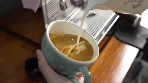 Pouring Milk into Espresso Cup, Latte Art Close Up Stock Footage 334823852