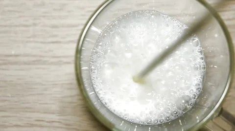 Pouring milk in the glass . Video stock 50054901