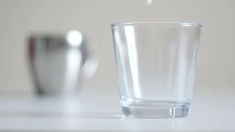 Pouring milk in a glass Stock Footage 84069754