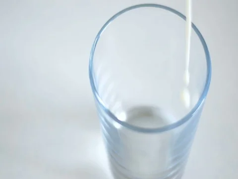 Pouring milk in a glass Stock Footage 84070155