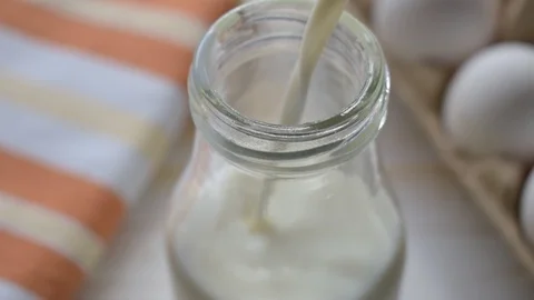 Pouring Milk In The Glass Stock Footage 87314342
