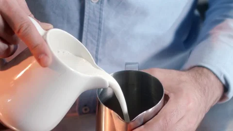 Pouring milk into a glass Stock Footage 129662965