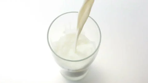 Pouring Milk into a Glass 库存影片 327402456