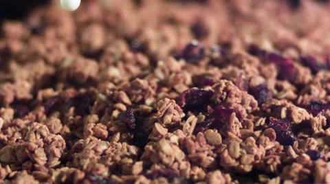 Pouring milk on granola with cranberries Stock Footage
