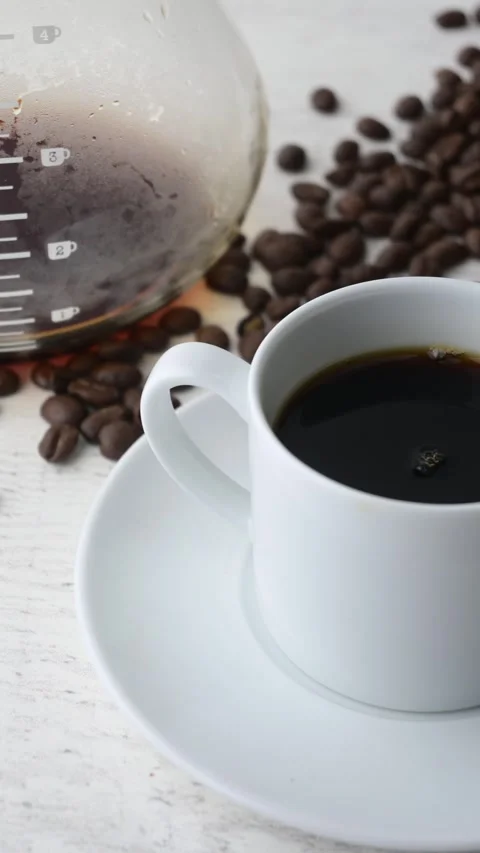 Pouring milk into hot coffee Stock-Footage 273637041