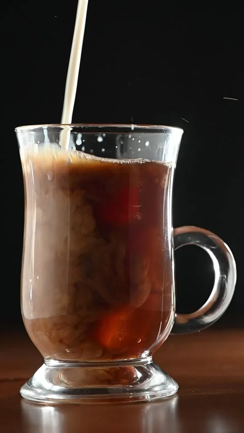 Pouring Milk into Iced Coffee Glass Stock Footage 331776216