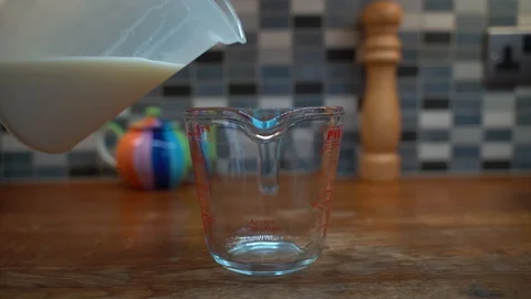 Pouring Milk in Jug Stock Footage 92843694