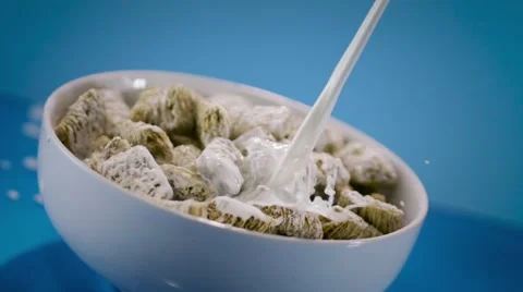 Pouring Milk in Mini Wheats Cereal Stock Footage 63634600
