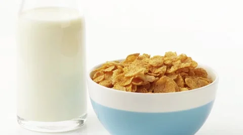 Pouring milk over cornflakes Stock Footage 8571814