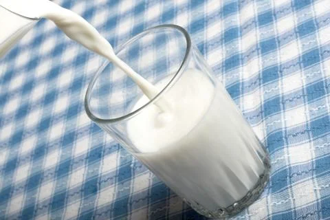 Pouring milk Stock Photos