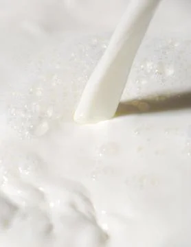 Pouring milk Foto stock