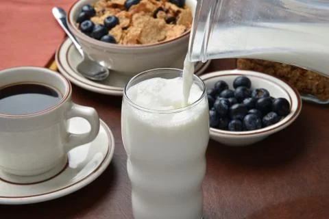 Pouring milk Stock Photos