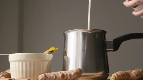Pouring milk into pot. Stock Footage 142825764