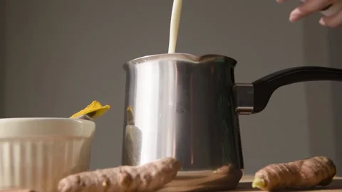 Pouring milk into pot. Stock Footage 142825771