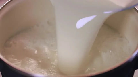 Pouring Milk In A Pot. Stock Footage 146129555