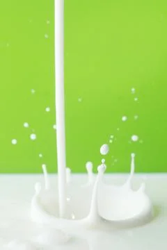 Pouring milk splash Stock Photos