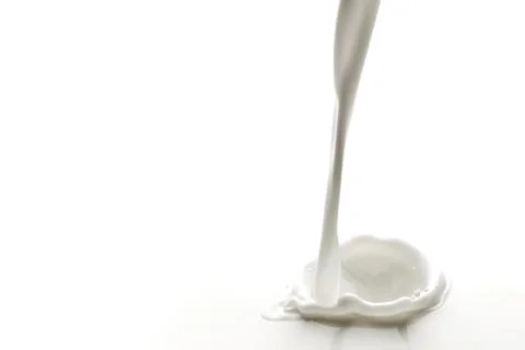 Pouring milk splash Stock Photos