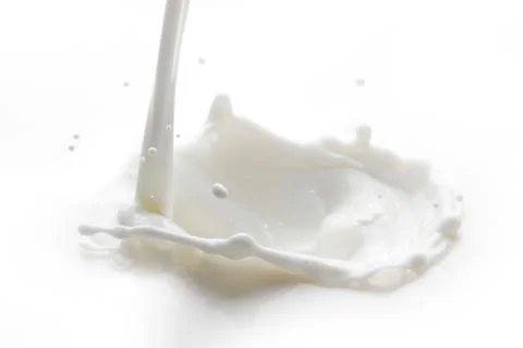 Pouring milk splash Stock Photos