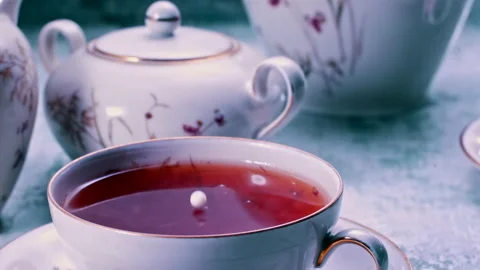 Pouring Milk in Tea Cup on the Table Super slow motion 1000fps Stock Footage 130982943