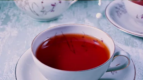 Pouring Milk in Tea Cup on the Table Super slow motion 1000fps Stock Footage 130985492