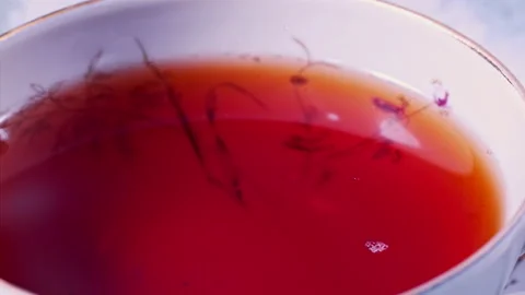 Pouring Milk in Tea Cup on the Table Super slow motion 1000fps Stock Footage 130985993