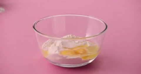 Pouring in milk while whisking 2 Stock Footage 132148815