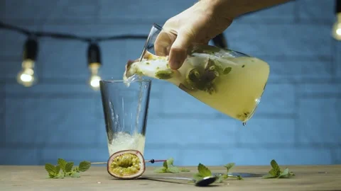 Pouring mint and passion fruit drink Stock Footage 143097668