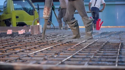 Pouring mixed concrete after installing steel reinforcement to create a house. Stock Footage 315511738