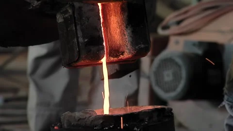Pouring Molten Metal For Casting Process In Historic Church Bell Workshop - 4K Stock Footage 339692929