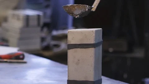 Pouring molten tin into the casting form Stock Footage 73069137