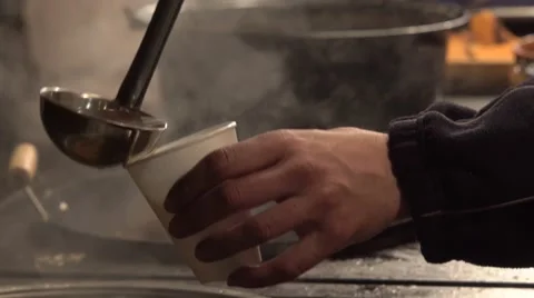 Pouring mulled wine into plastic cup 4K Stock Footage 58515063