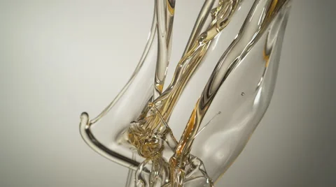 Pouring oil and making splashes. Slow Motion. Stock Footage