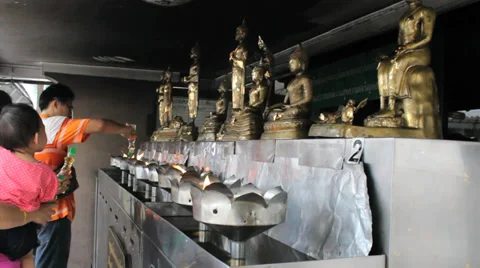 Pouring Oil At Buddhist Temple Stock Footage