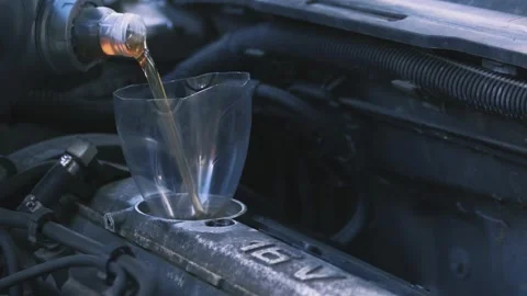 Pouring oil into the engine 02 스톡 동영상 205512456