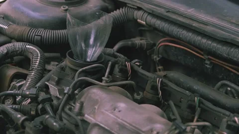 Pouring oil into the engine 03 스톡 동영상 205530641