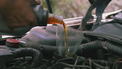Pouring oil into the engine 04 스톡 동영상 205530995