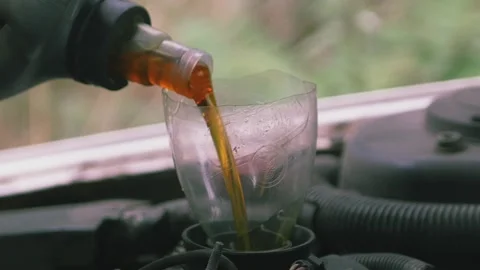 Pouring oil into the engine 06 스톡 동영상 205531468