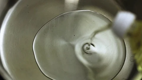 Pouring oil Stock Footage