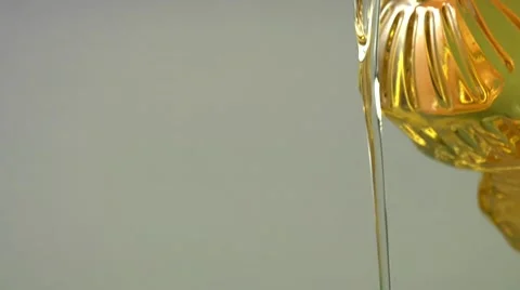 Pouring oil out of a bottle Stock Footage 8572353