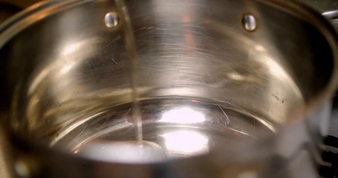 Pouring oil into a pan Stock Footage 88048044