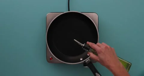 Pouring oil in a pan Video stock 132149764