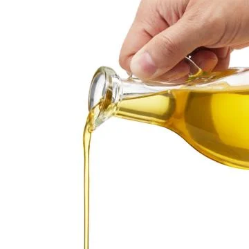 Pouring oil Stock Photos