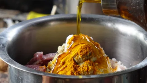 Pouring Oil on Raw Mutton 스톡 동영상 332534774