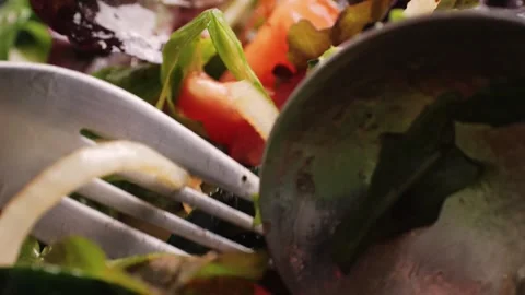 Pouring olive oil on healthy fresh vegetables vegan salad, close up, Delicious Stock Footage 241754555