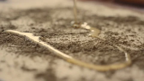 Pouring olive oil over bread dough with zatar spice Stock Footage 274681607