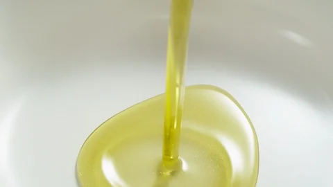 Pouring olive oil. Slow Motion. Stock Footage