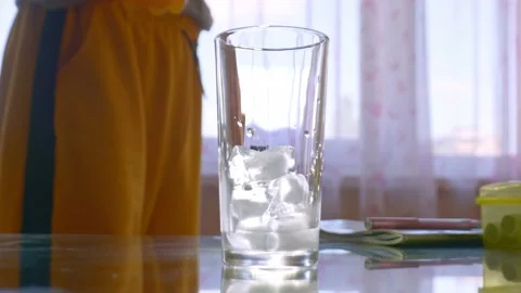 Pouring orange drink into glass Stock Footage 201690383