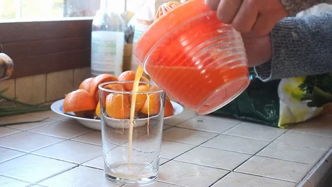 Pouring orange juice Stock Footage 105070207